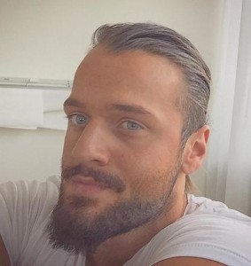 A handsome male with blue eyes and long blonde hair in a man bun hairstyle  with a beard - Long Hair Guys