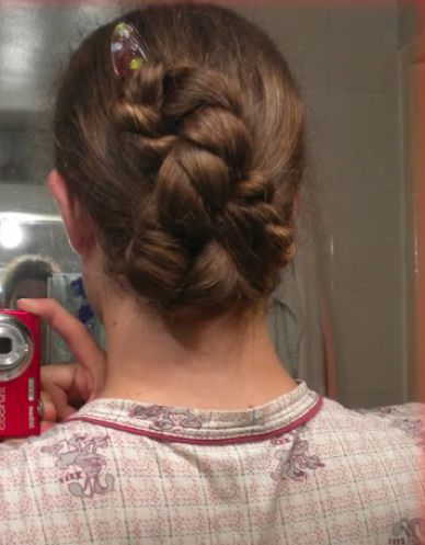 A rare photograph of a braided Figure 8 bun hairstyle for dudes