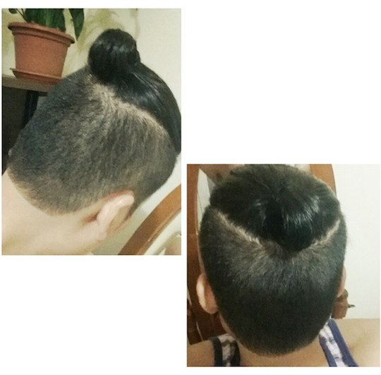 A barbershop photograph depicting the disconnected undercut haircut for the man bun in a hair salon customer