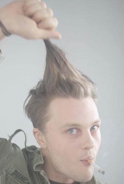 A photograph of Michael Pitt as Jimmy Darmody getting ready to cut his long slicked back undercut hairstyle