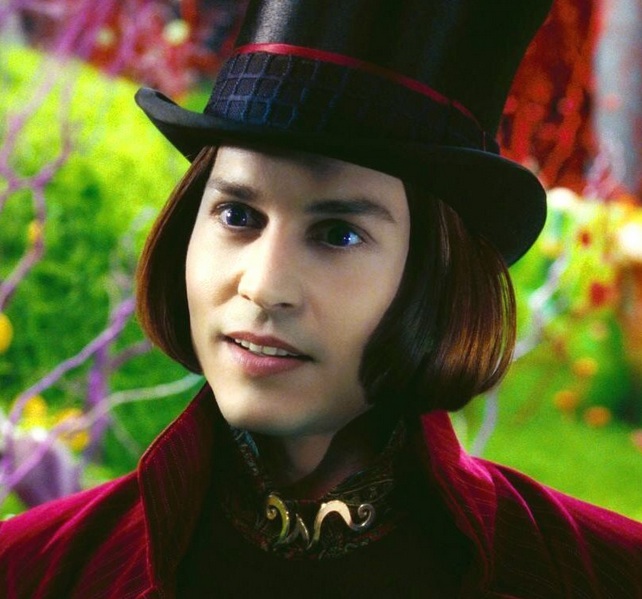 A clear picture of Johnny Depp with long red hair while playing Willy Wonka with his trademark redhead hairstyle