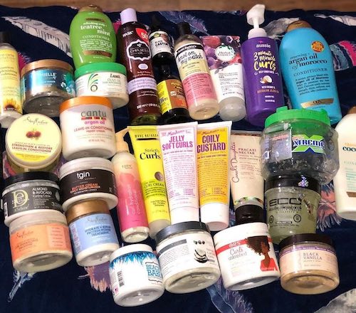 A photograph of a huge selection of long mens hair producs including conditioners and styling creams